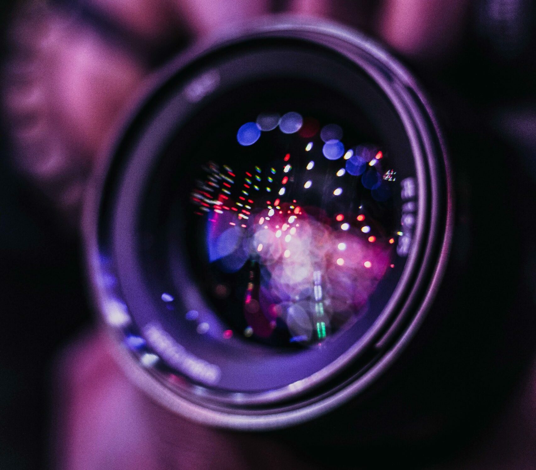 Vibrant reflections in a camera lens; an artistic photography close-up.